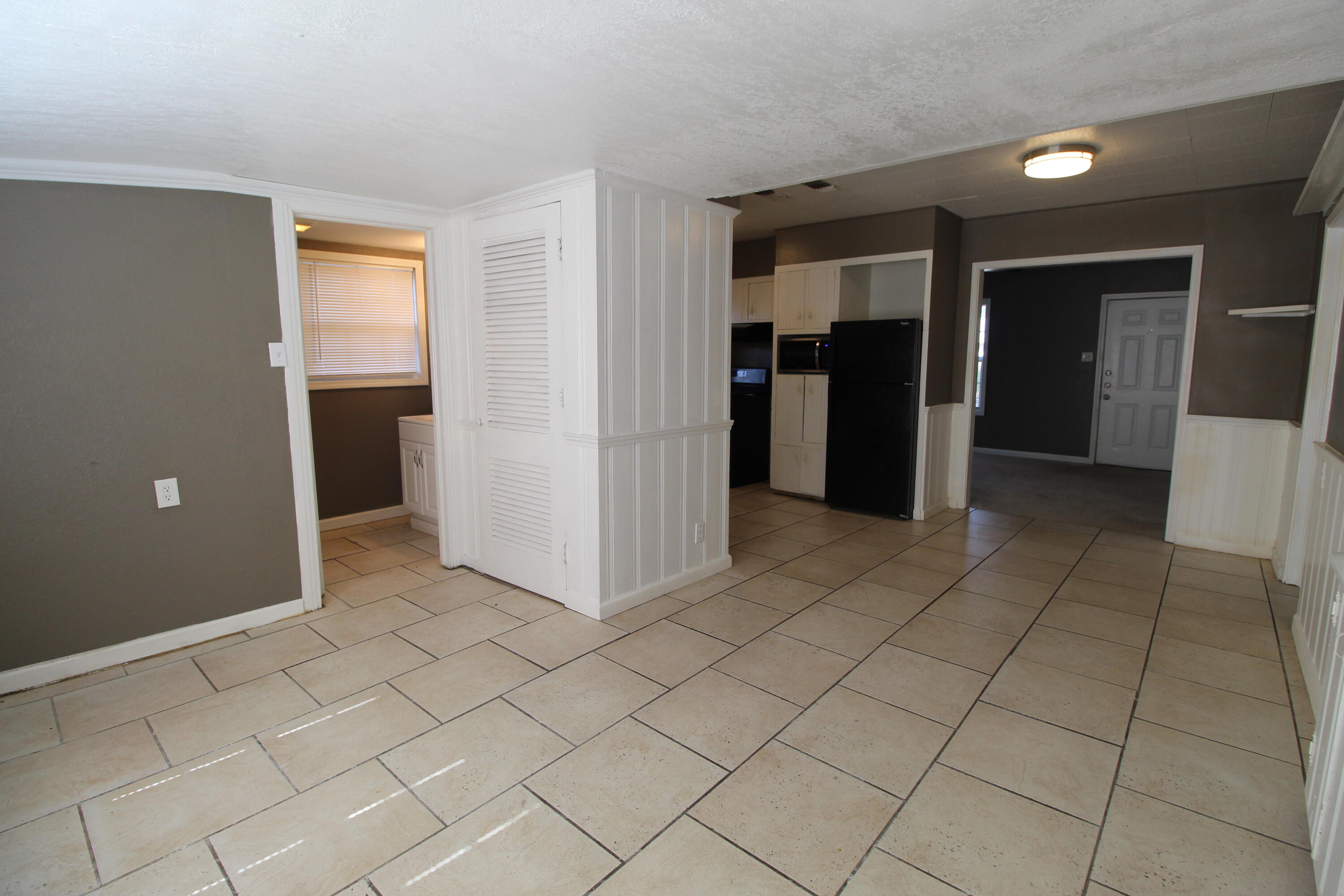 2209 25th Street Lubbock, TX 79411 - Photo 9 of 22 a view of a utility room with closet and windows