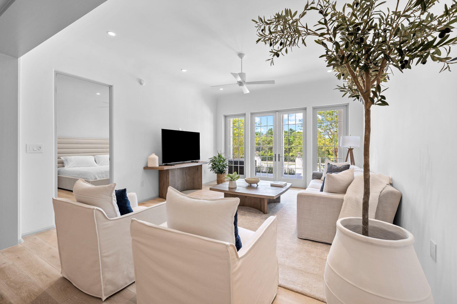 45 West Solaire Way Inlet Beach, Unit 102 Inlet Beach, FL 32461 - Photo 1 of 35 Living room with doors out to patio