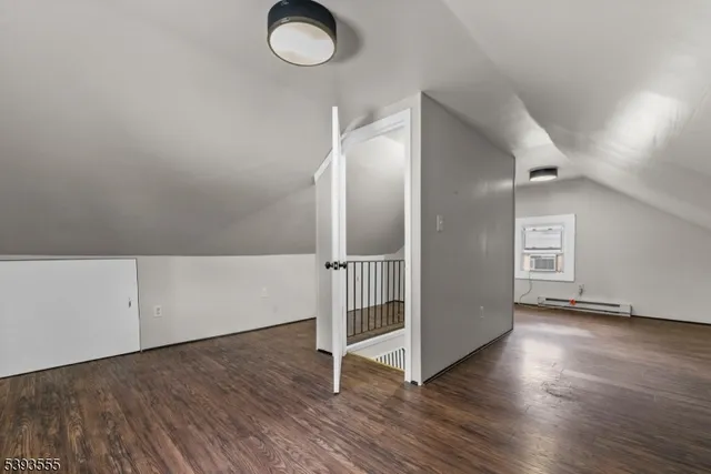 an empty room with wooden floor