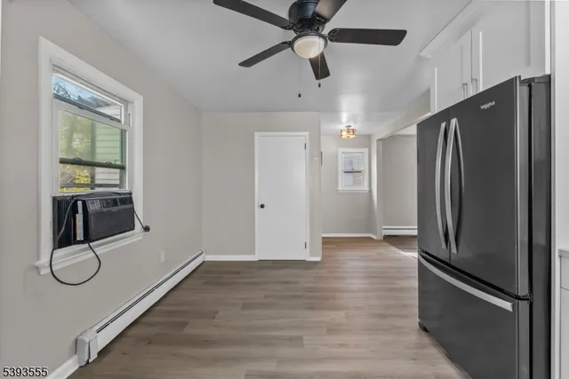 a kitchen with stainless steel appliances a refrigerator and cabinets