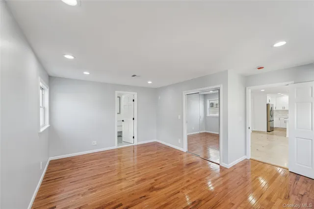 a bedroom with a large bed and a couch