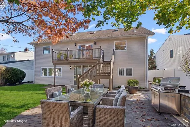 an empty room with a window and wooden floor