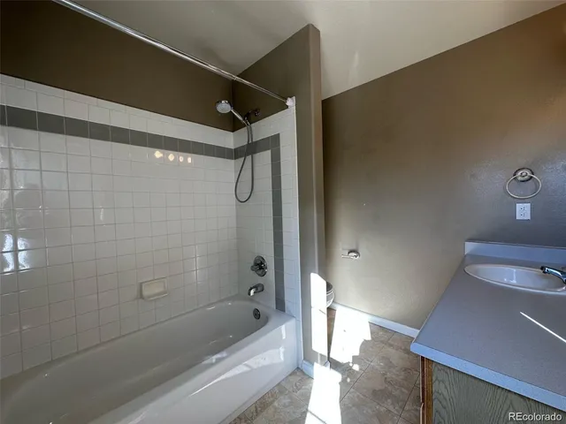 a bathroom with a shower and a tub