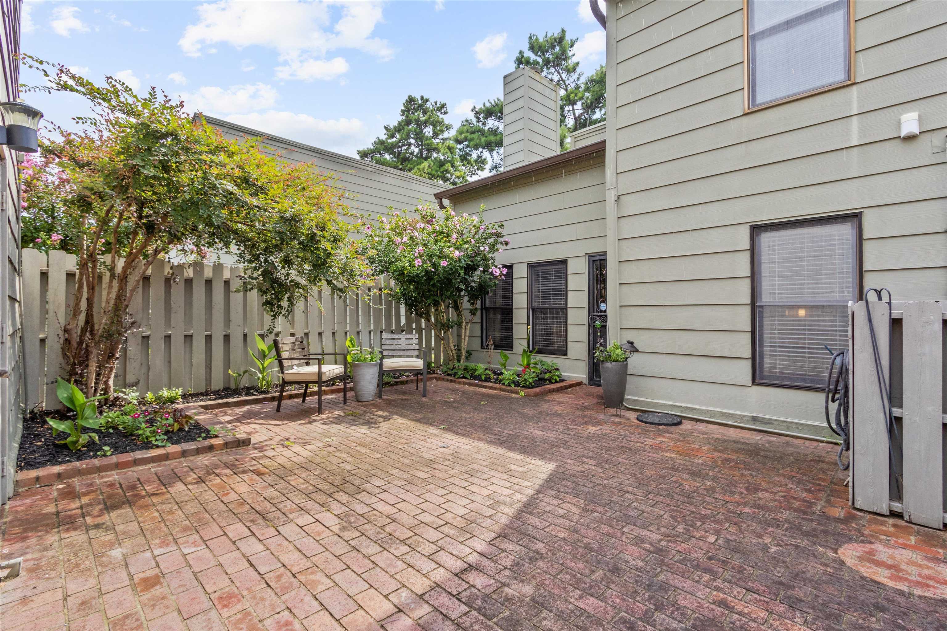 1906 Allenby Road, Unit 16 Germantown, TN 38139 - Photo 24 of 31 Brick patio with perimeter landscaping and a privacy fence