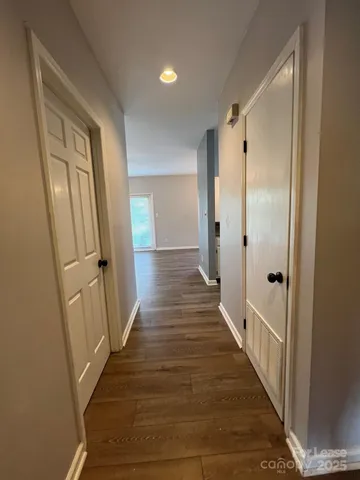 a kitchen with granite countertop a sink stainless steel appliances and cabinets