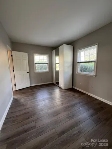 a view of backyard with seating space and trampoline