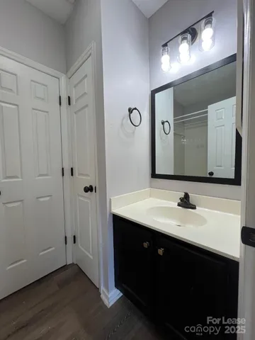 a bathroom with a double vanity sink and a mirror