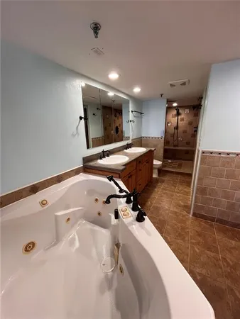 a view of a kitchen with a sink and furniture