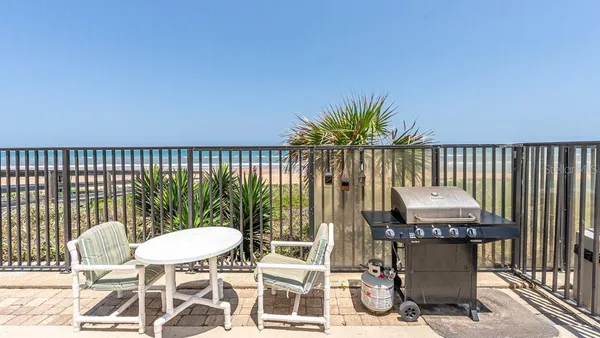 a balcony with a water view