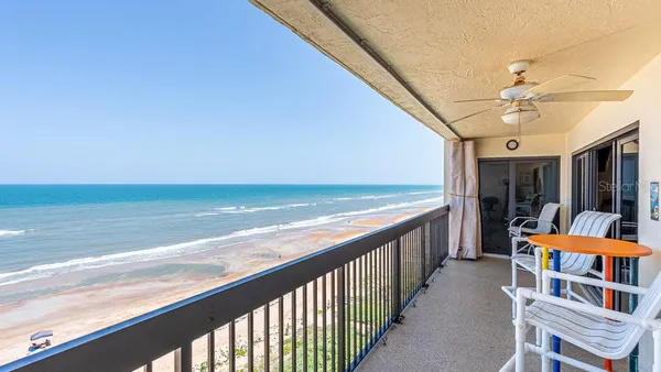 a balcony with an ocean view