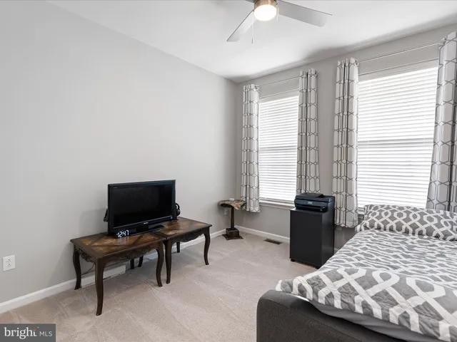 a bedroom with furniture and windows