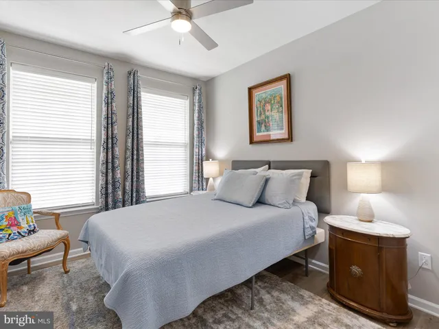 a bedroom with bed and window