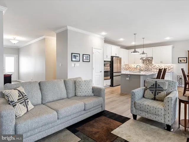 a view of living room kitchen with furniture and kitchen view