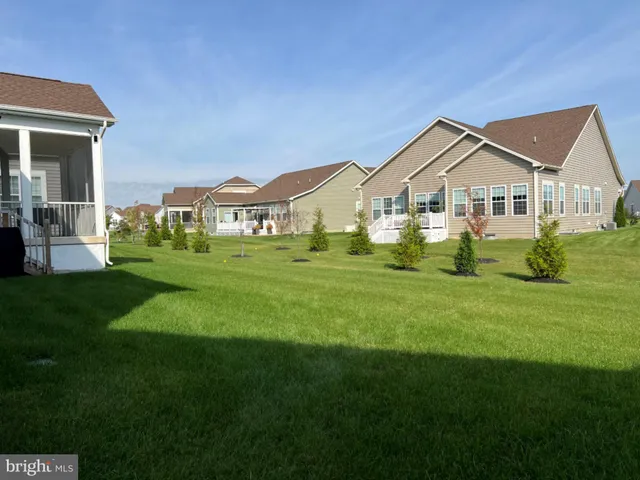 a front view of a house with a garden and porch