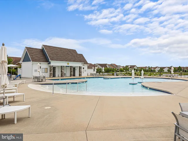 a view of house with outdoor space and seating area