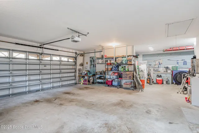a view of a garage with a bike and car
