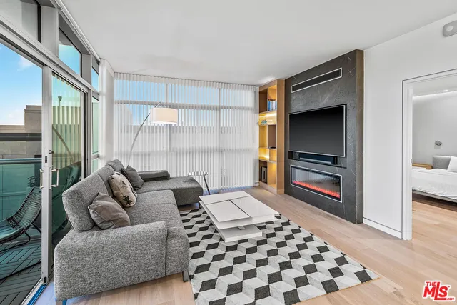 a living room with furniture and a rug