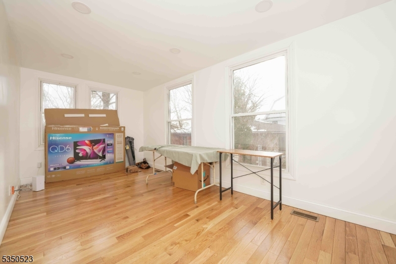 21 Woodland Road Bloomfield, NJ 07003 - Photo 13 of 20 a view of a room with furniture and a window