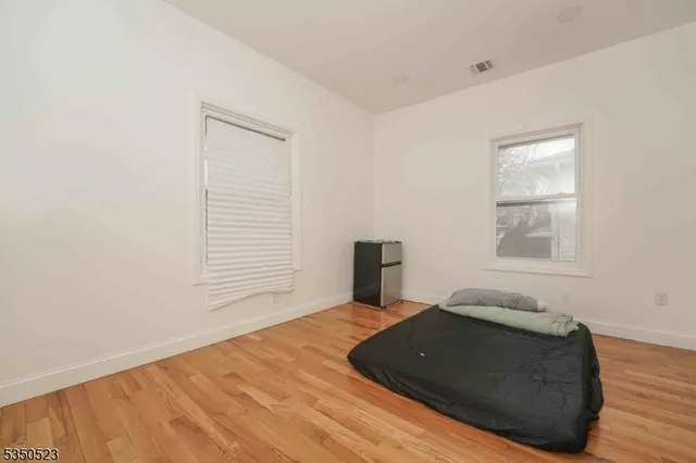 a room with a bed and a window