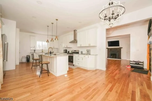 a view of kitchen with cabinets and wooden floor