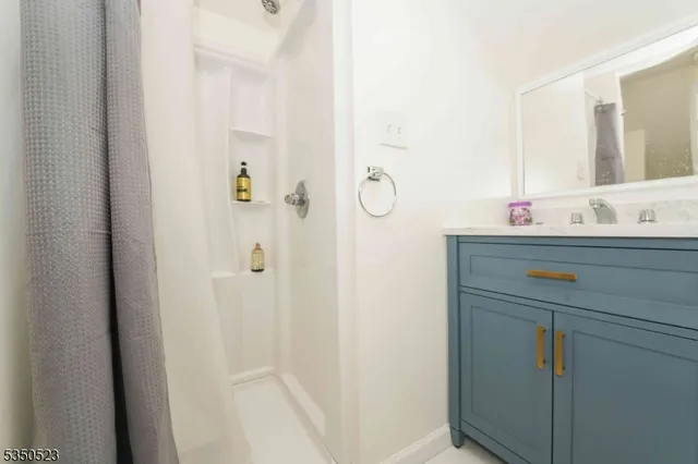 a bathroom with a sink and mirror
