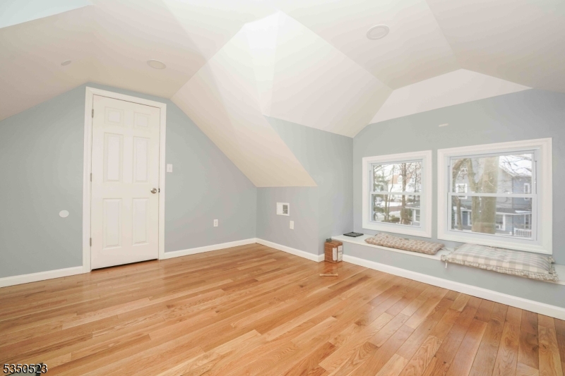 21 Woodland Road Bloomfield, NJ 07003 - Photo 8 of 20 a view of an empty room with a window