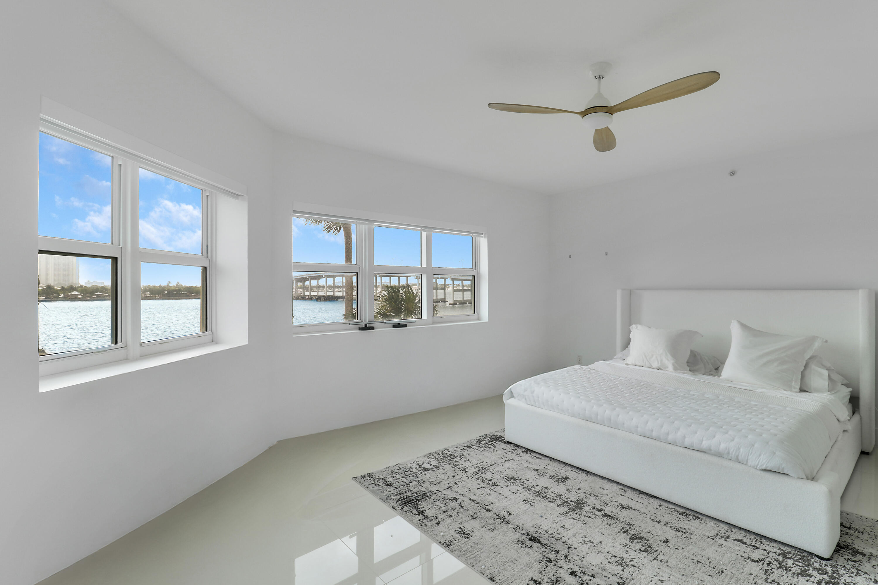 2640 Lake Shore Drive, Unit 307 Riviera Beach, FL 33404 - Photo 27 of 44 a bedroom with a bed and a window