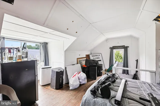 a bedroom with furniture and a window