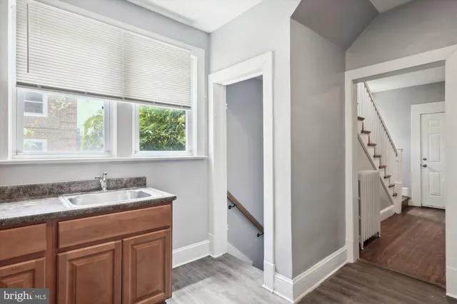 a view of a kitchen from a hallway