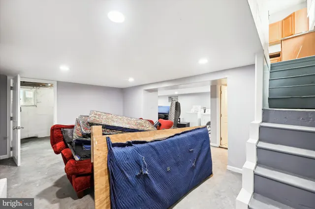 a room with a bed and furniture