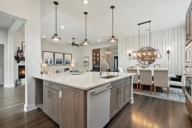 a kitchen with stainless steel appliances kitchen island a large island in the center