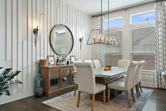 a large kitchen with stainless steel appliances a stove a sink dishwasher and a refrigerator