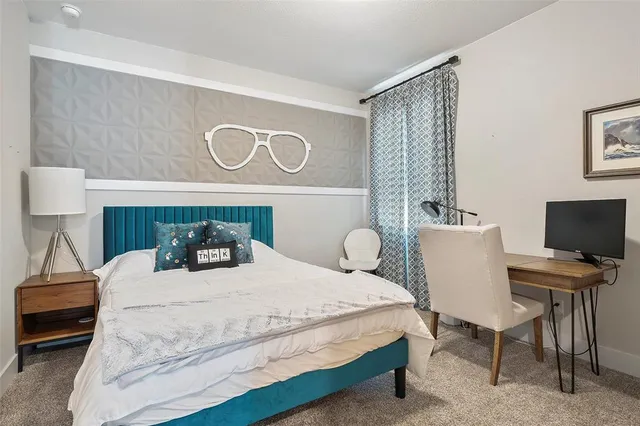 a bedroom with a bed and a couch