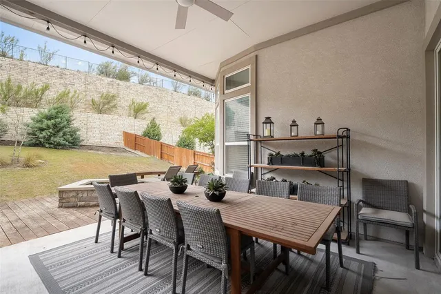 a living room with fireplace furniture and a chandelier