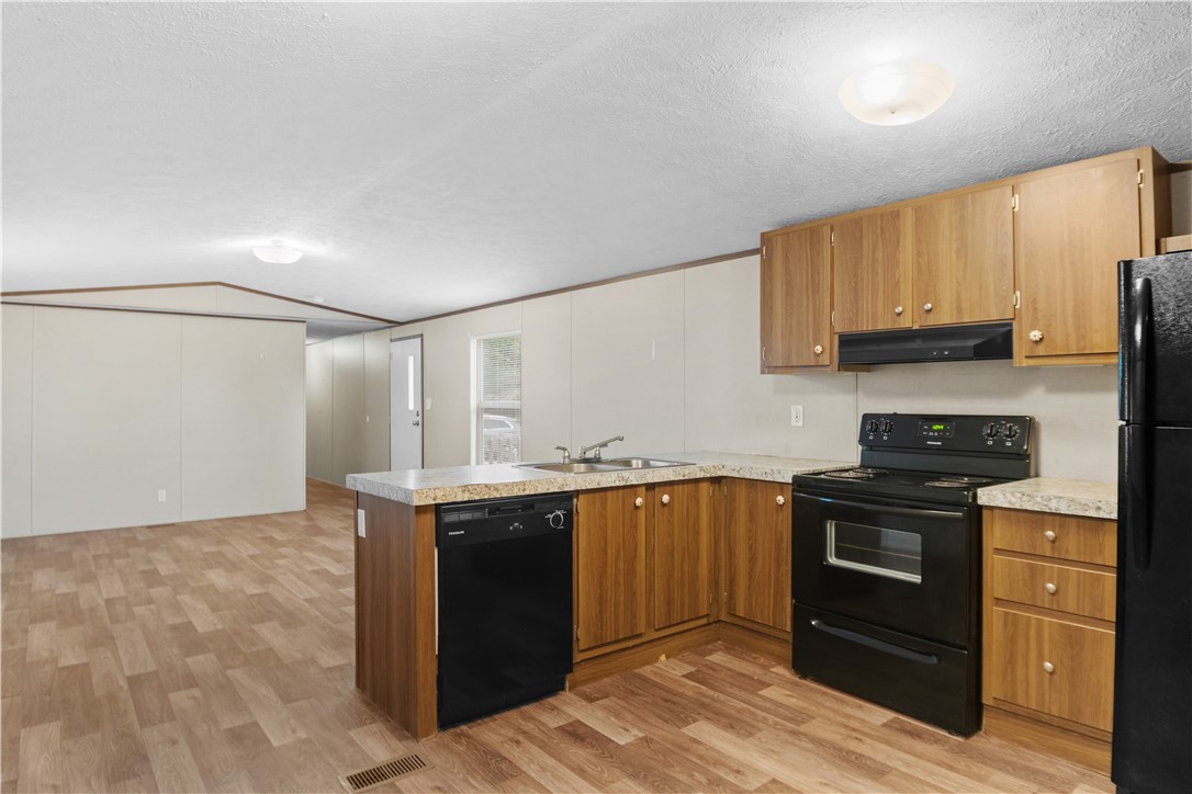 1188 Old Liberty Road Easley, SC 29640 - Photo 14 of 28 This spacious kitchen offers a practical layout with ample cabinetry and essential appliances.