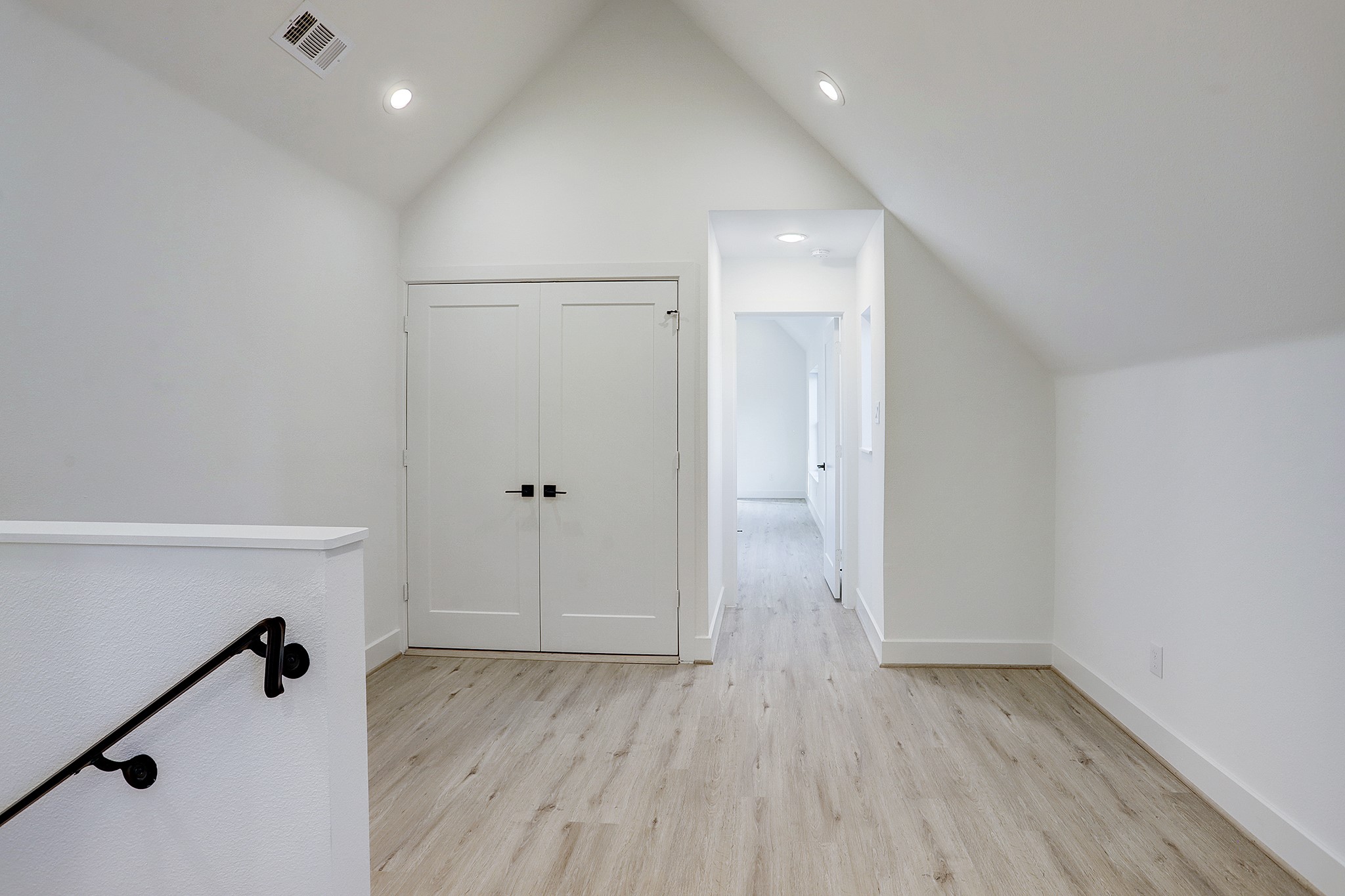 7407 Rusk Street, Unit B Houston, TX 77011 - Photo 17 of 24 a view of empty room with wooden floor