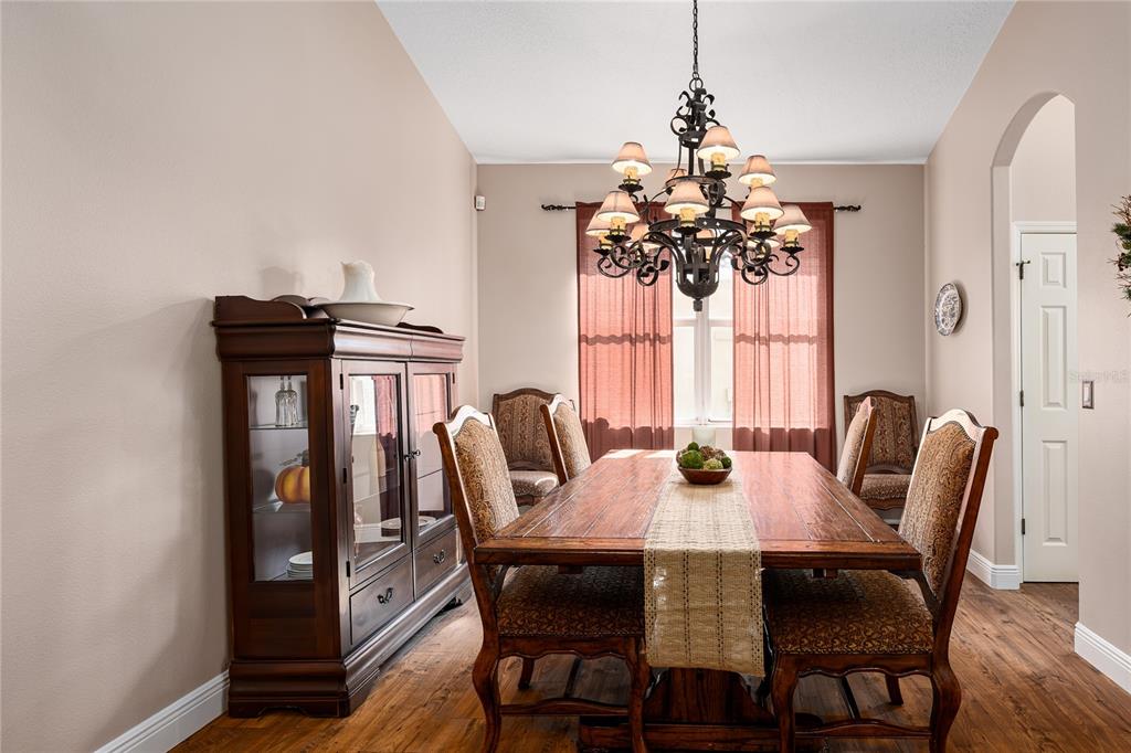 6552 Tailfeather Way Bradenton, FL 34203 - Photo 15 of 65 a view of a dining room with furniture and window