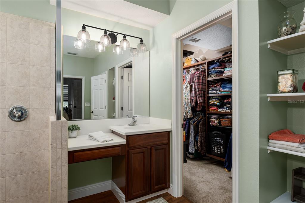 6552 Tailfeather Way Bradenton, FL 34203 - Photo 23 of 65 a en suite bathroom with a sink double vanity and a mirror