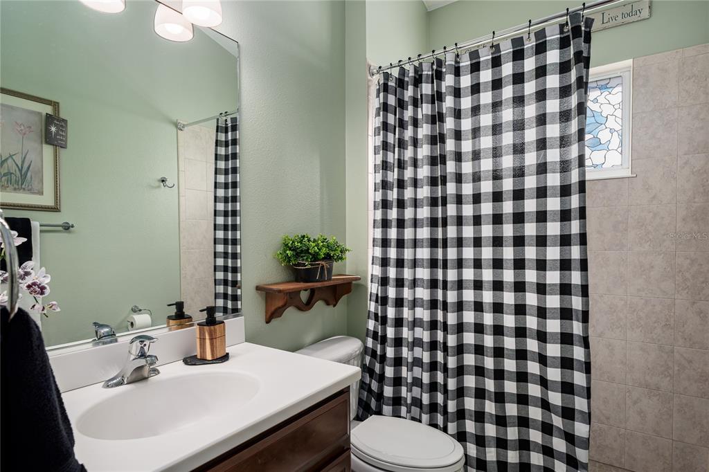 6552 Tailfeather Way Bradenton, FL 34203 - Photo 27 of 65 a bathroom with a sink toilet and shower