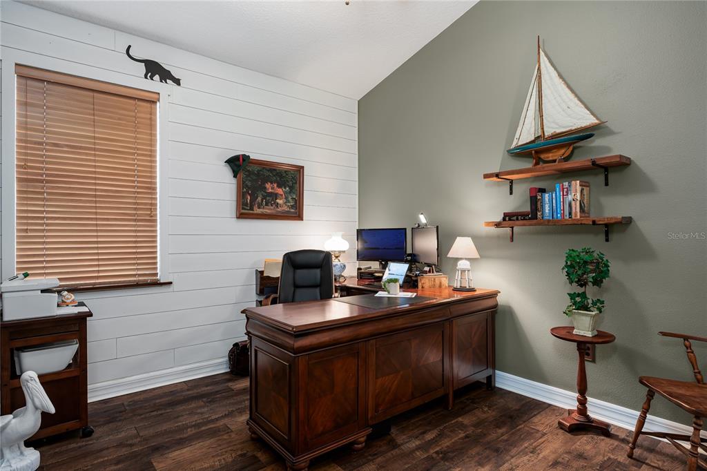 6552 Tailfeather Way Bradenton, FL 34203 - Photo 28 of 65 a work room with furniture and wooden floor
