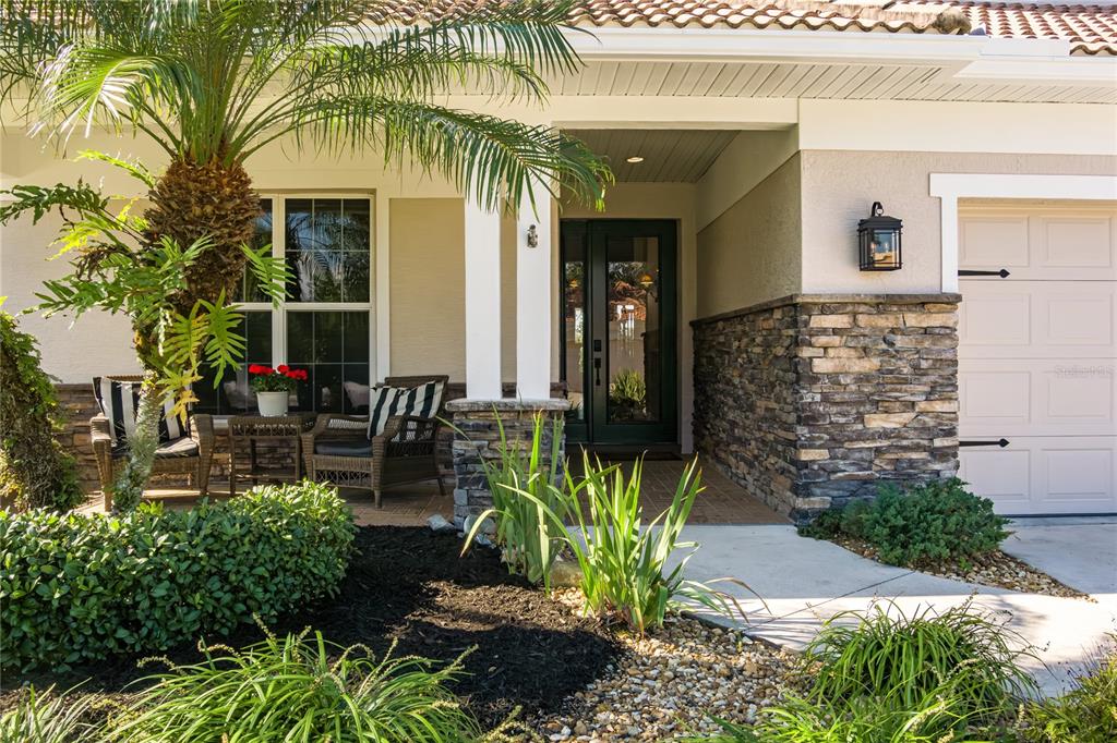 6552 Tailfeather Way Bradenton, FL 34203 - Photo 36 of 65 a front view of a house with garden