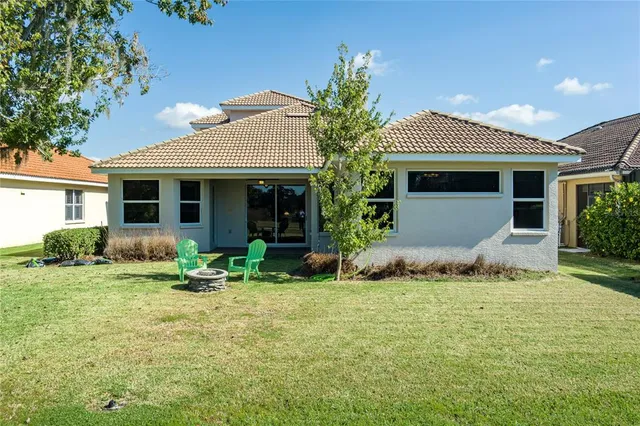 an aerial view of a house with garden space and street view
