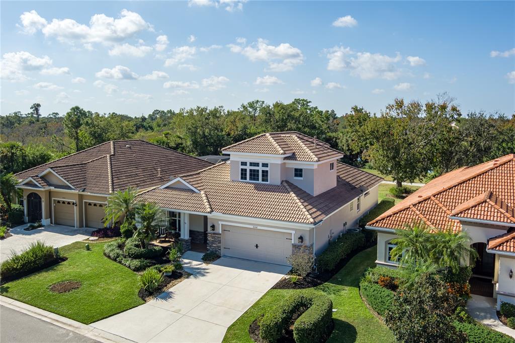 6552 Tailfeather Way Bradenton, FL 34203 - Photo 44 of 65 a aerial view of a house with a yard and potted plants