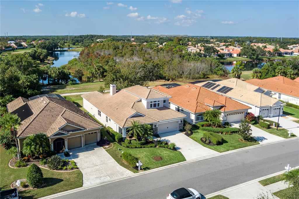 6552 Tailfeather Way Bradenton, FL 34203 - Photo 46 of 65 an aerial view of a house with garden space and street view