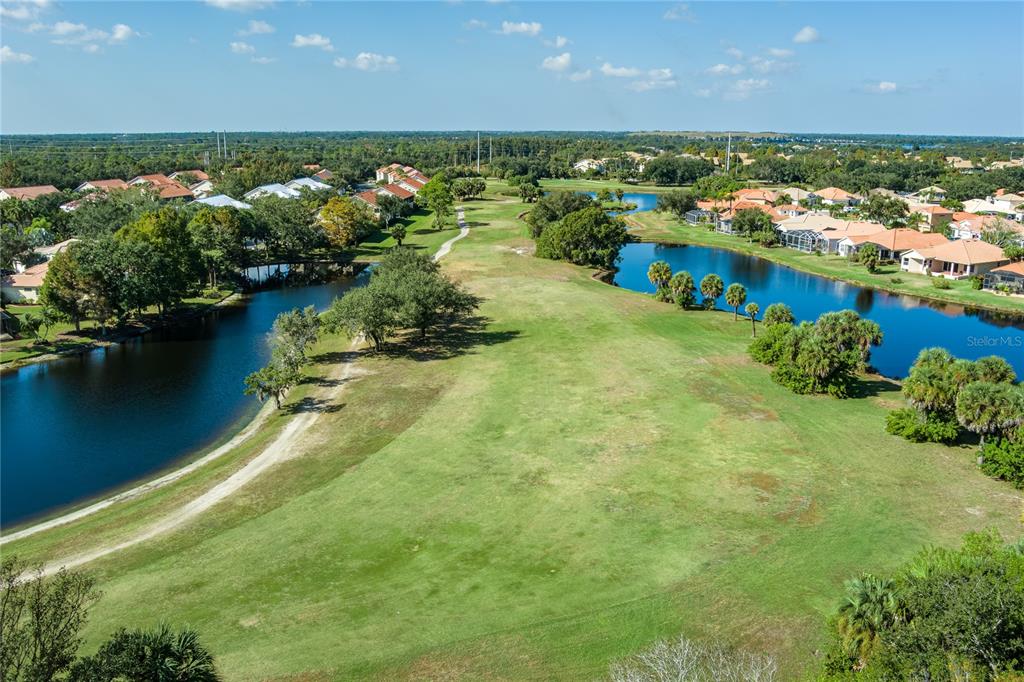6552 Tailfeather Way Bradenton, FL 34203 - Photo 49 of 65 an aerial view of residential houses with outdoor space and lake view