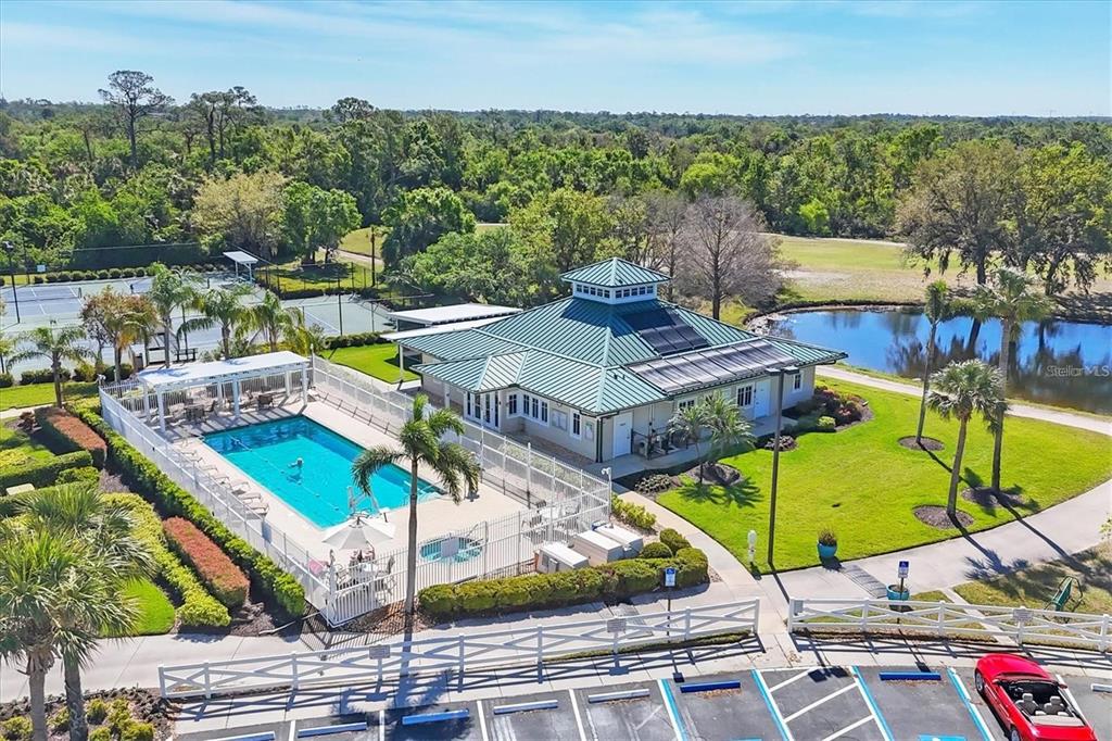 6552 Tailfeather Way Bradenton, FL 34203 - Photo 58 of 65 a view of a tennis ground with a table and chairs