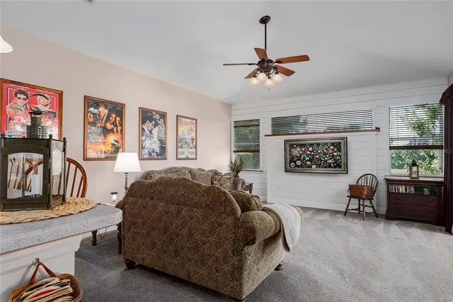 a kitchen with kitchen island granite countertop a sink stove and refrigerator