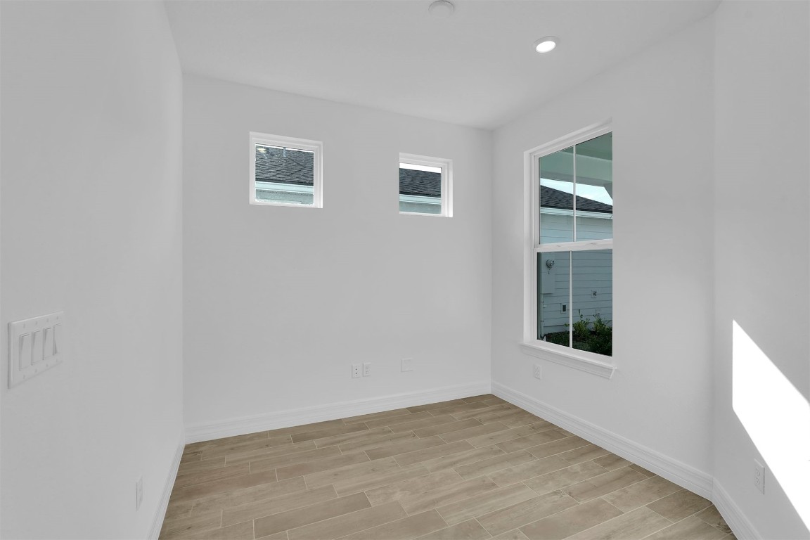 608 Ecliptic Loop Yulee, FL 32097 - Photo 20 of 45 an empty room with windows