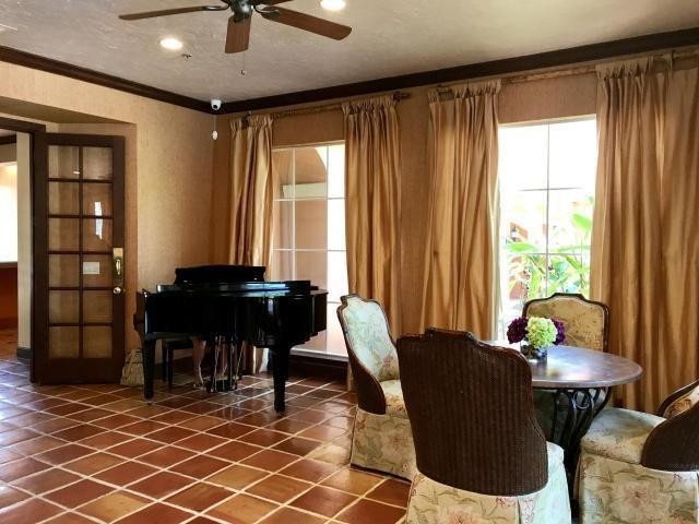 3111 Clint Moore Road, Unit 206 Boca Raton, FL 33496 - Photo 23 of 28 a living room with furniture and a window