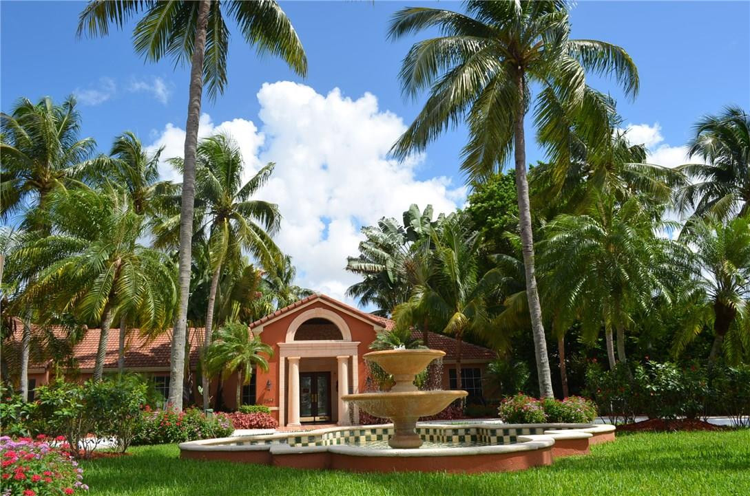 3111 Clint Moore Road, Unit 206 Boca Raton, FL 33496 - Photo 3 of 28 a front view of a house with garden